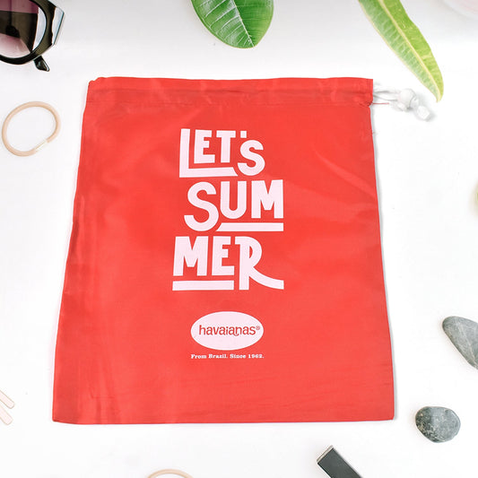 Multipurpose drawstring bag in red on a clean white background.