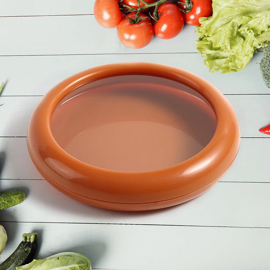 Vegetable & Fruit Saver container, round shape, clear lid, on a kitchen counter.