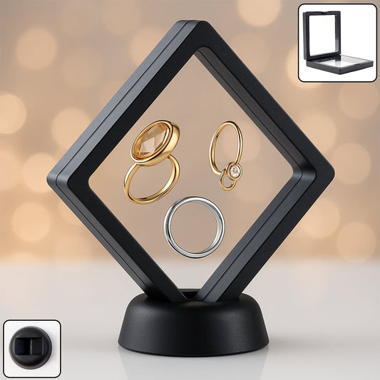 Transparent floating jewellery display box showcasing rings and earrings at an exhibition