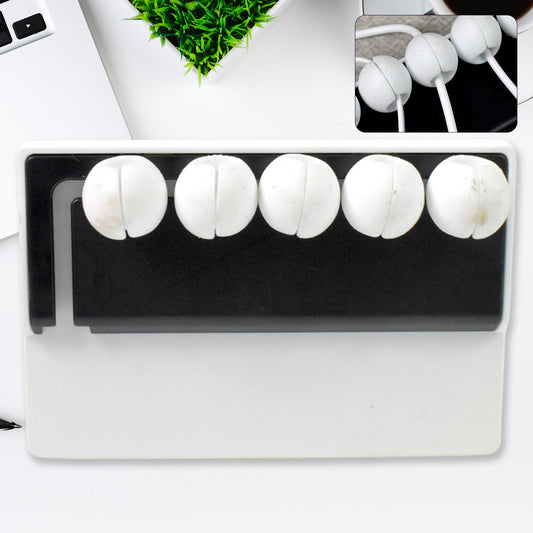 5-slot adhesive cable holder organizing wires on a desk