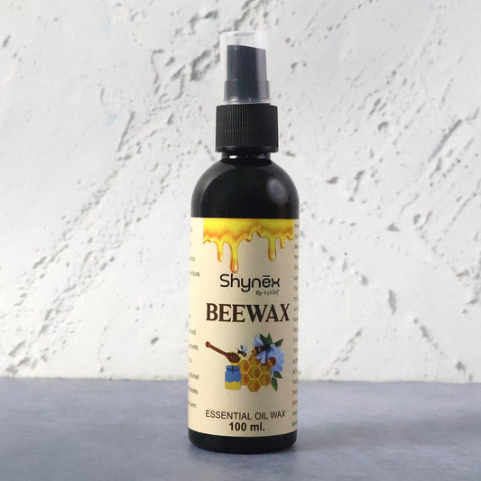 Beeswax Furniture Polish spray bottle highlighting natural ingredients for wood and leather care.
