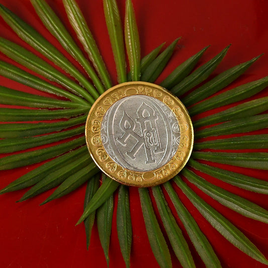 Dual-tone Lakshmi Ganesh religious coin with silver center and gold border