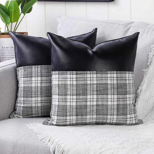 Close-up of a pair of Styleva Leather & Cotton Pillow Covers with elegant texture.