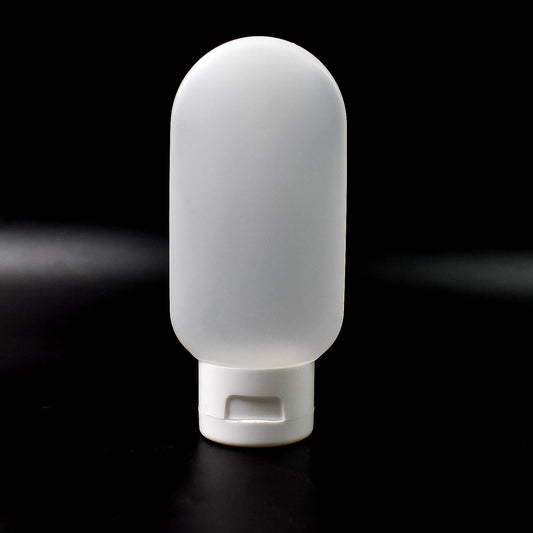 A single 60ml reusable plastic travel bottle in a vibrant mixed color, ready for toiletries.