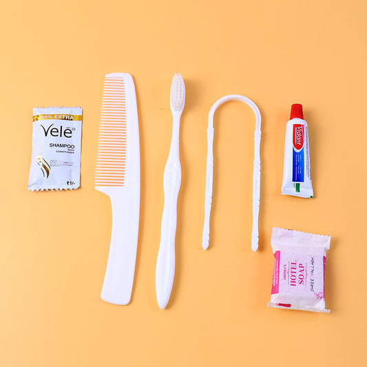 Hotel guest toiletry kit with toothbrush, soap and shampoo sachet