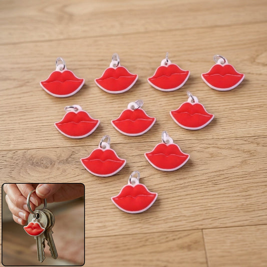Red lips shape keychain attached to a handbag, stylish accessory